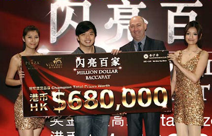 The winner Mr Tse with his winner's cheque