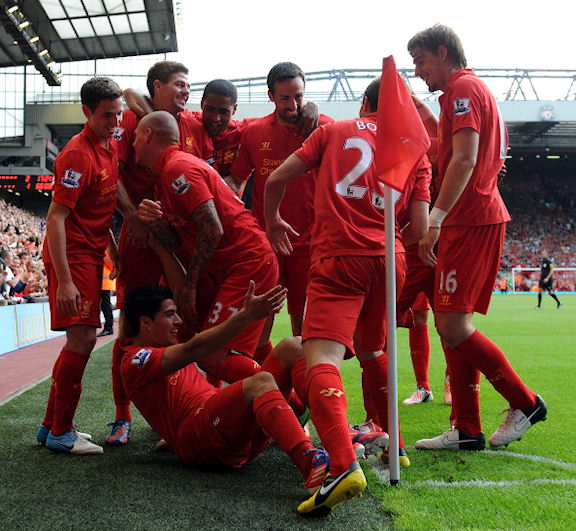 Young and ambitious Liverpool celebrating a goal against Manchester City