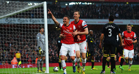 After relegating Wigan, Arsenal edged close to a top-four finish