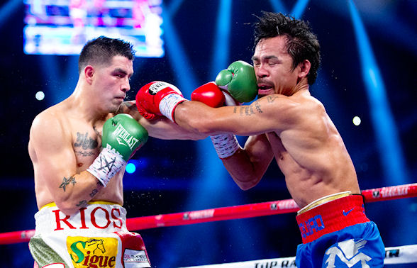 Brandon Rios lands a rare punch on the face of boxing legend Manny Pacquiao during their November fightat Cotai Arena